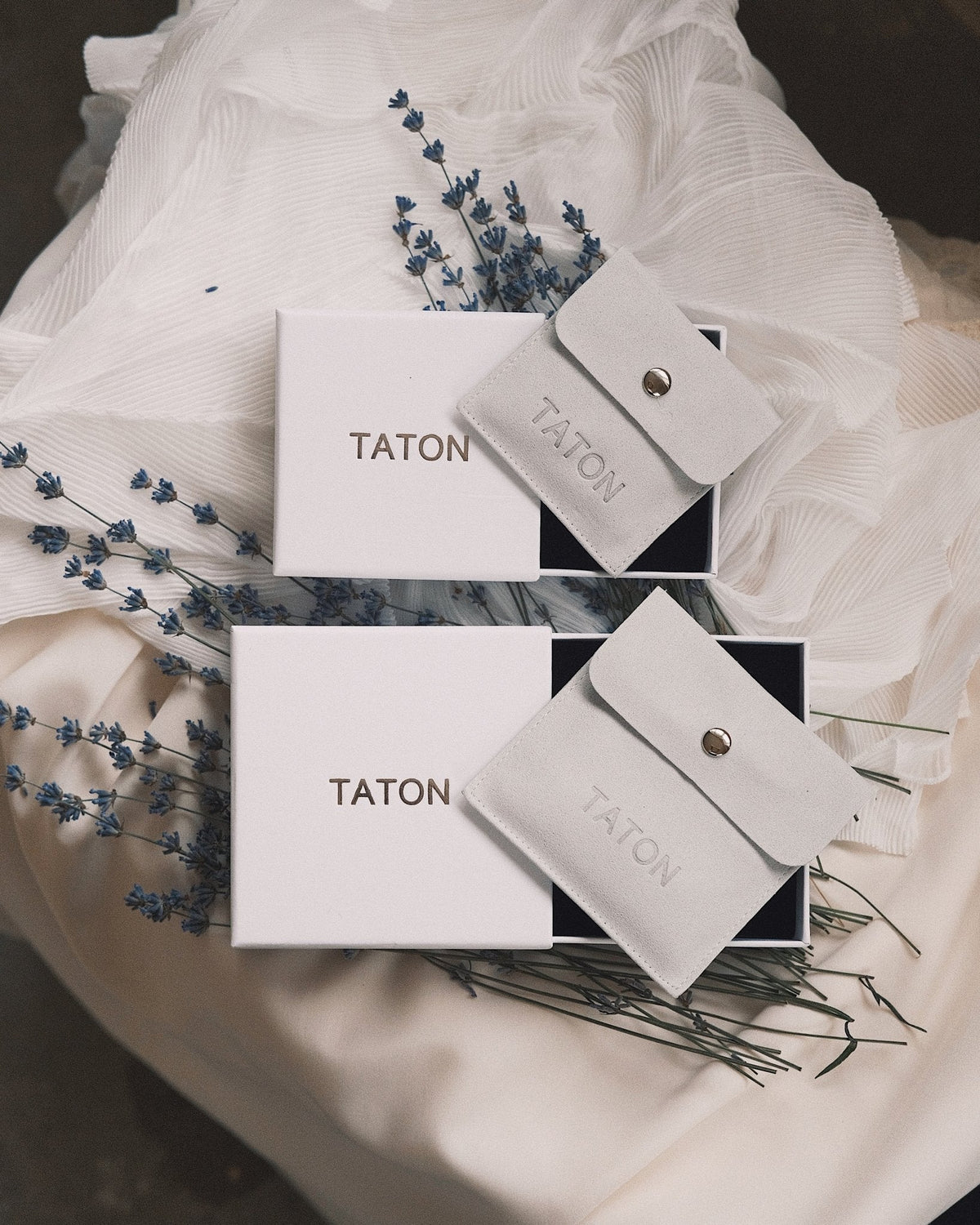 Taton gift box, ribboned, with a piece set on the card inside